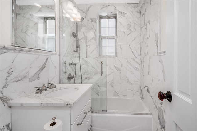 bathroom featuring vanity and combined bath / shower with glass door