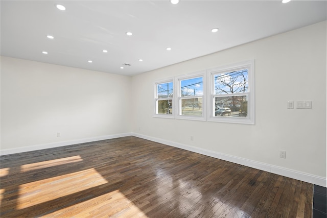 empty room with wood-type flooring