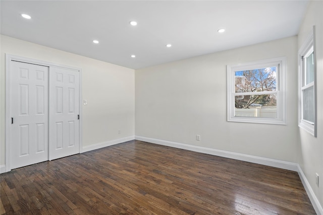 empty room featuring dark wood-type flooring