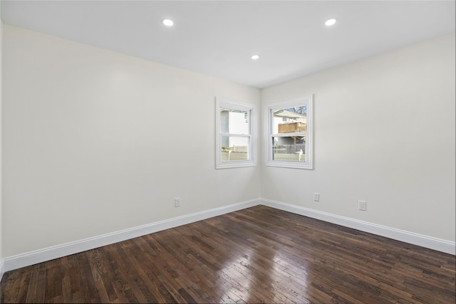 empty room featuring dark wood-type flooring