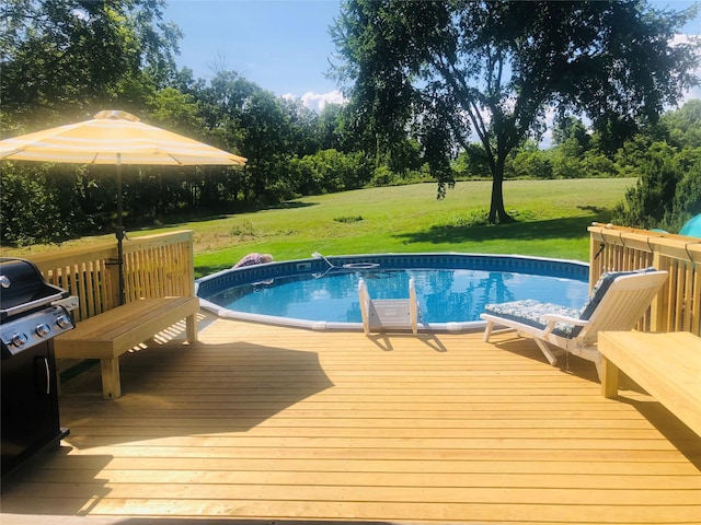 69 Lippincott Rd, Wallkill, NY 12589 - swimming pool featuring a grill, a wooden deck, and a yard