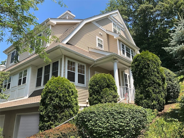 view of side of home with a garage