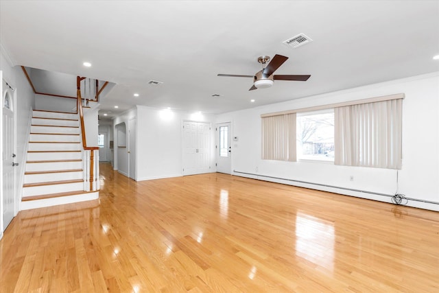 unfurnished living room featuring ceiling fan, light wood-type flooring, and a baseboard heating unit