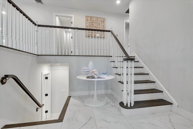 stairs with a towering ceiling