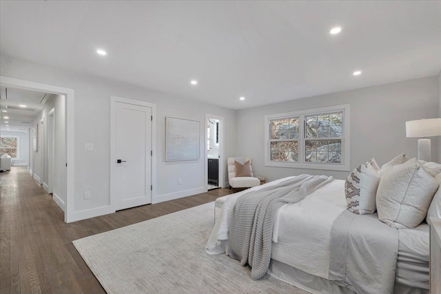 bedroom featuring dark hardwood / wood-style flooring