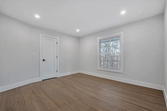 spare room featuring hardwood / wood-style floors