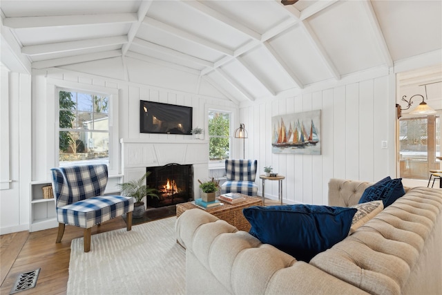 living room with hardwood / wood-style floors and lofted ceiling