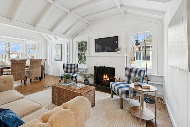 sunroom / solarium featuring lofted ceiling