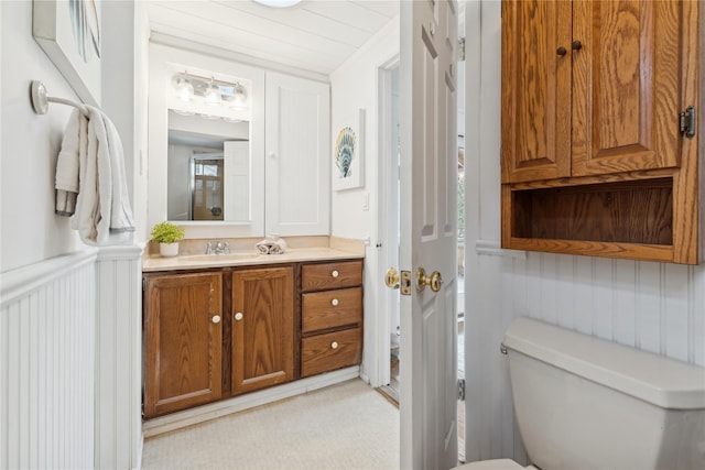 bathroom with toilet and vanity