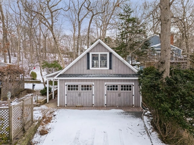 view of snow covered garage