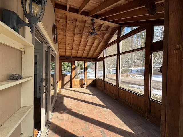 sunroom / solarium with ceiling fan, wood ceiling, and vaulted ceiling with beams