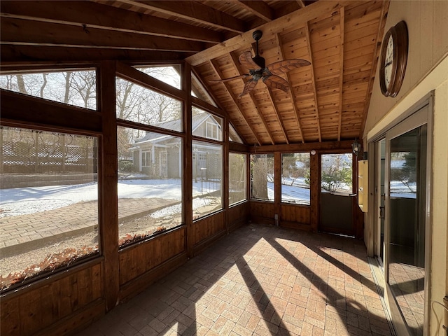 unfurnished sunroom featuring wooden ceiling, vaulted ceiling with beams, and ceiling fan