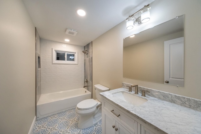 full bathroom with toilet, vanity, tiled shower / bath, and tile patterned flooring