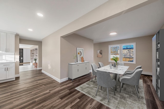 dining area featuring dark hardwood / wood-style flooring and a baseboard radiator