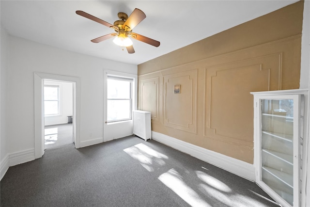 unfurnished bedroom featuring ceiling fan