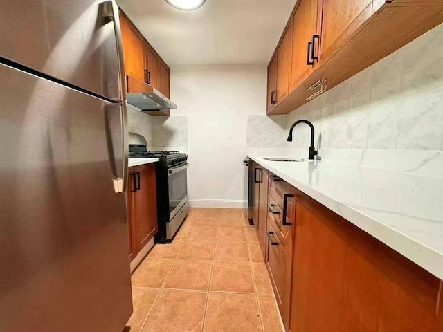 kitchen featuring backsplash, sink, light tile patterned flooring, and stainless steel appliances