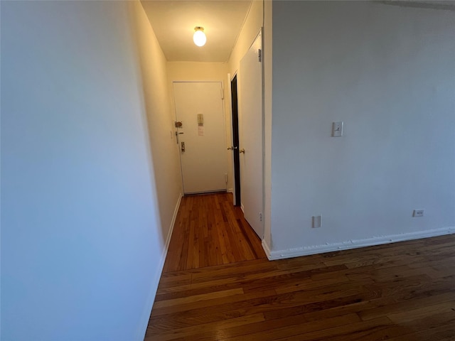 corridor featuring dark hardwood / wood-style flooring