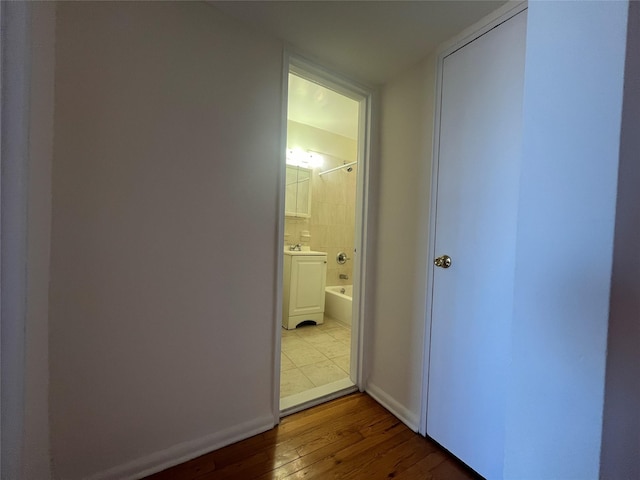 hall with light hardwood / wood-style floors