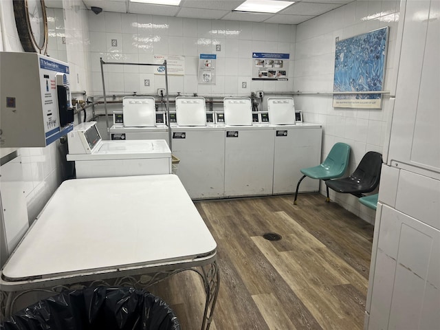 clothes washing area with dark hardwood / wood-style floors