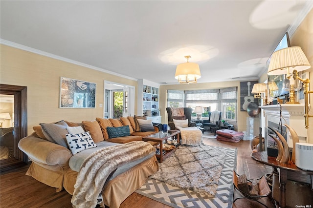 living room with built in features, ornamental molding, and wood-type flooring