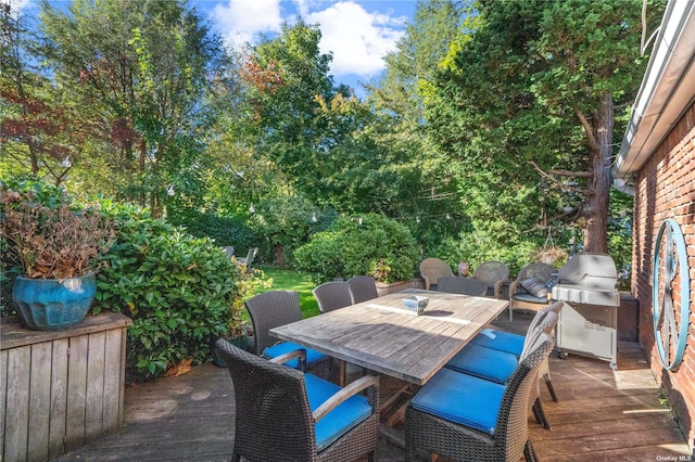 view of patio featuring a grill and a deck