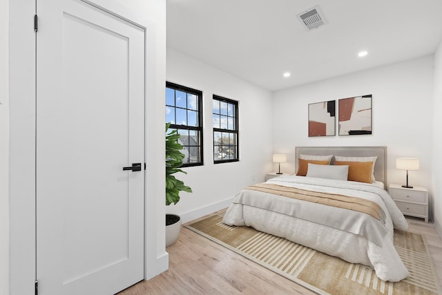 bedroom featuring light hardwood / wood-style floors