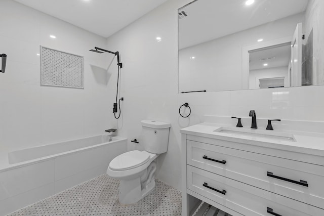 full bathroom with vanity, shower / bath combination, tile walls, and toilet