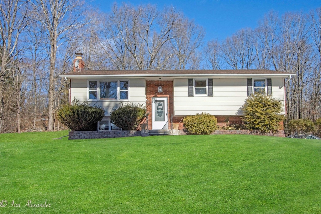 19 E Rd, Wallkill, NY 12589 - split foyer home with a chimney and a front yard