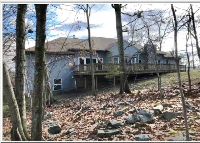 rear view of property with a deck