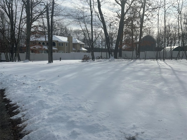 view of yard covered in snow