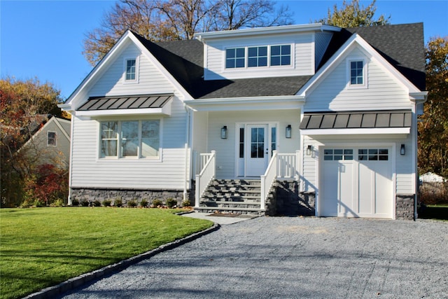 view of front of home featuring a front yard and a garage