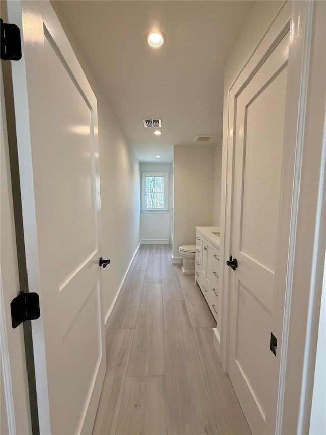 hallway featuring light hardwood / wood-style floors