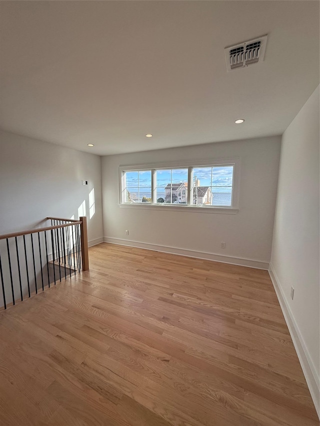 unfurnished room featuring light wood-type flooring