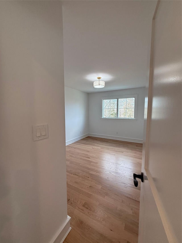 spare room featuring light hardwood / wood-style flooring