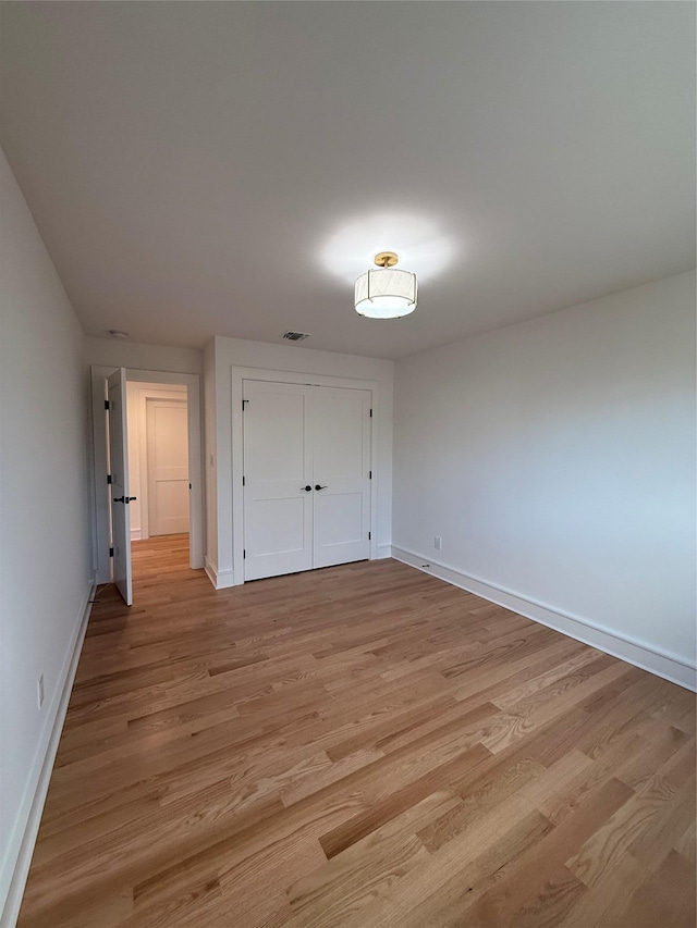 unfurnished bedroom featuring light hardwood / wood-style floors