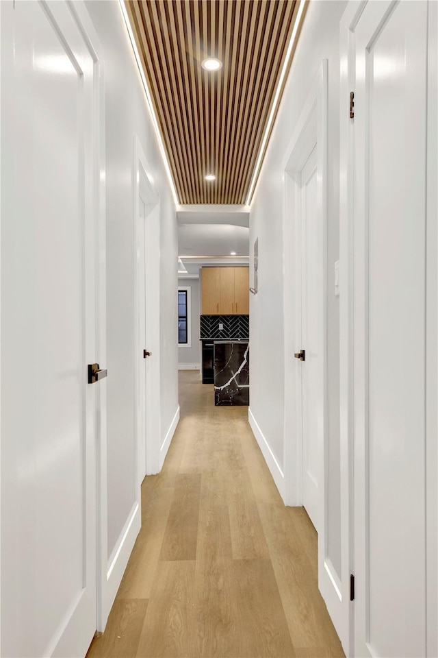 hall with light hardwood / wood-style floors