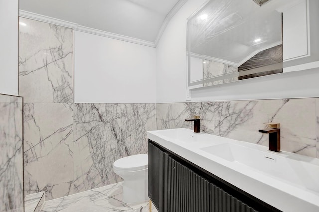 bathroom featuring crown molding, vanity, tile walls, and toilet