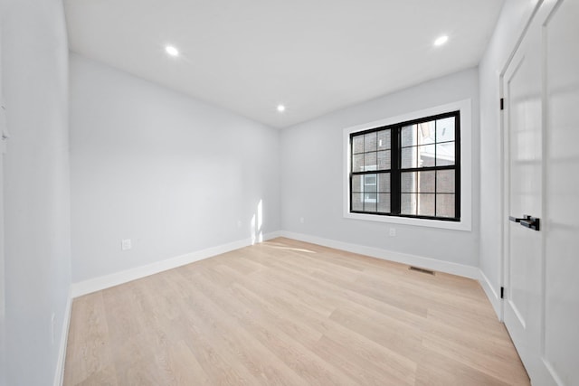 unfurnished room featuring light wood-type flooring