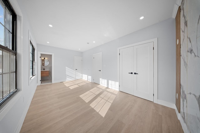 unfurnished room with light hardwood / wood-style flooring