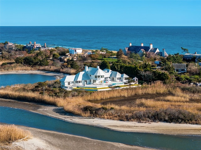 bird's eye view featuring a view of the beach and a water view