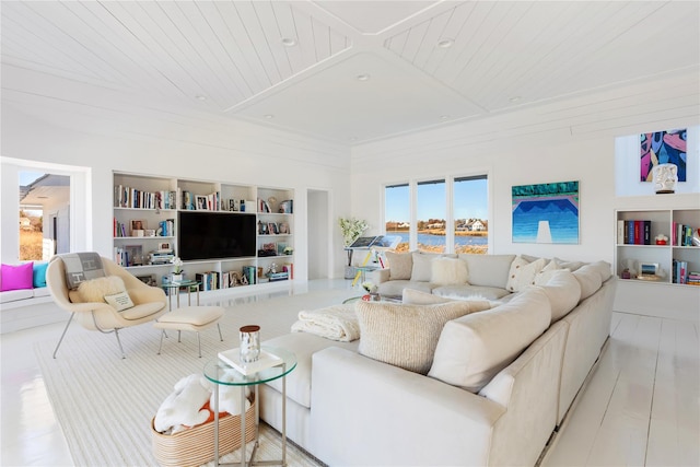 living room with built in shelves, light hardwood / wood-style floors, and wood ceiling