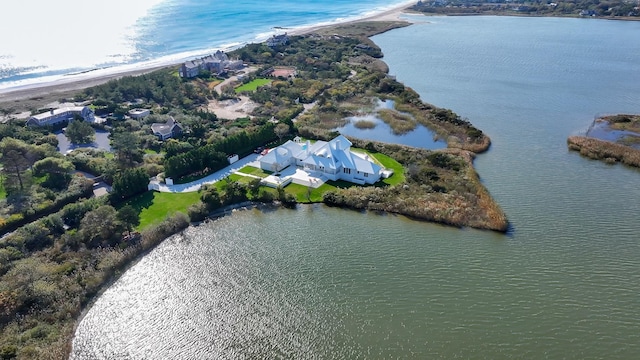 drone / aerial view featuring a water view and a beach view