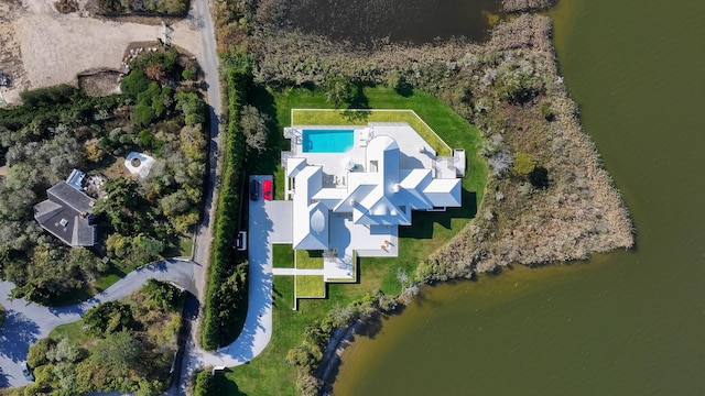 birds eye view of property with a water view