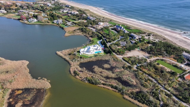 bird's eye view with a water view and a view of the beach