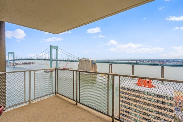 balcony featuring a water view