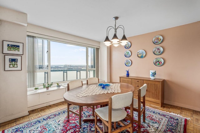 166-25 Powells Cove Blvd Unit 16M, Beechhurst, NY 11357 - dining area with a water view and a chandelier