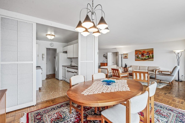 166-25 Powells Cove Blvd Unit 16M, Beechhurst, NY 11357 - dining area featuring a chandelier