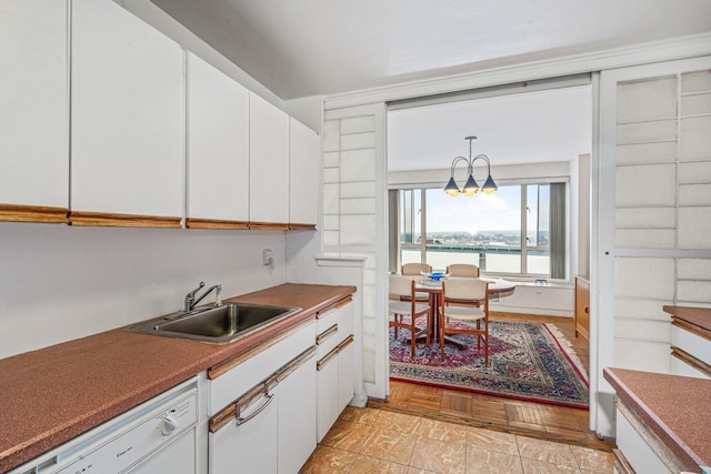 166-25 Powells Cove Blvd Unit 16M, Beechhurst, NY 11357 - kitchen featuring dishwasher, white cabinets, a chandelier, and hanging light fixtures