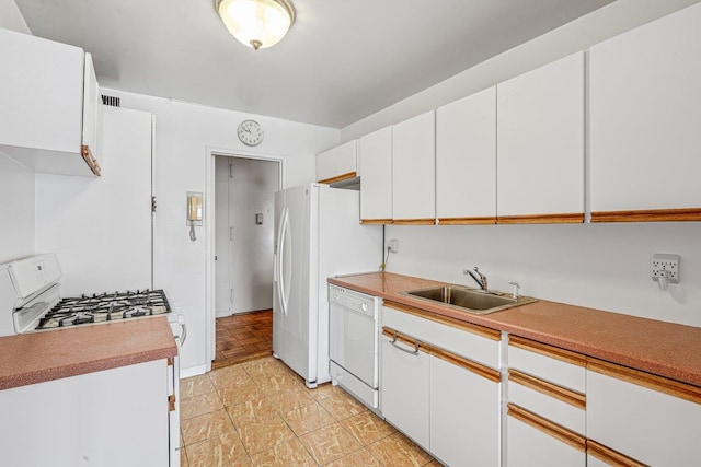 166-25 Powells Cove Blvd Unit 16M, Beechhurst, NY 11357 - kitchen featuring white appliances, white cabinetry, and light countertops