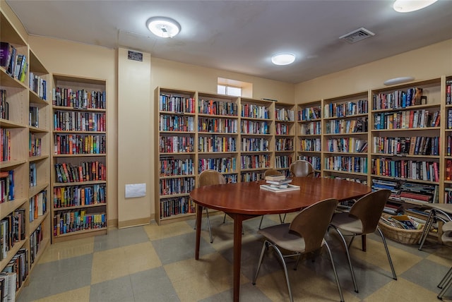 166-25 Powells Cove Blvd Unit 16M, Beechhurst, NY 11357 - home office with wall of books and tile patterned floors